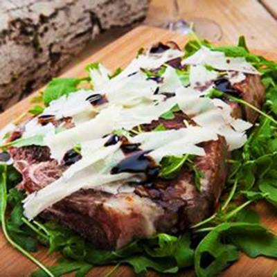 Florentine-style Steak with Arugula, Parmigiano and Organic Balsamic of Monticello