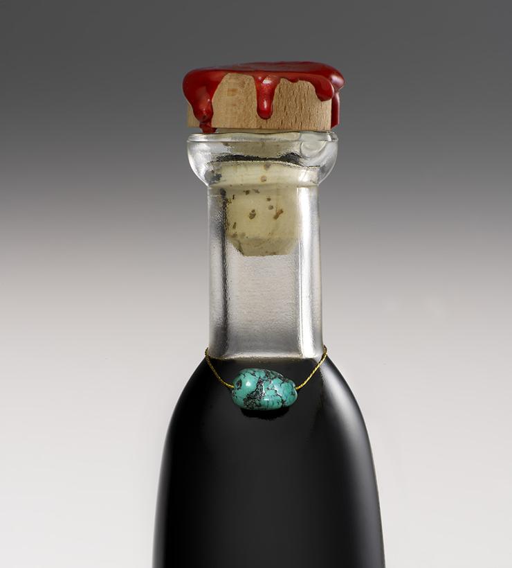 Close-up of the Monticello bottle neck and turquoise bead